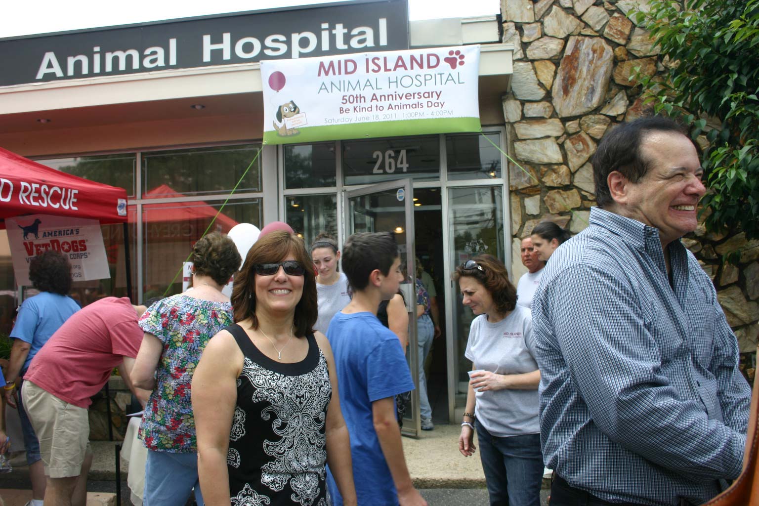 a group of people outside a hospital